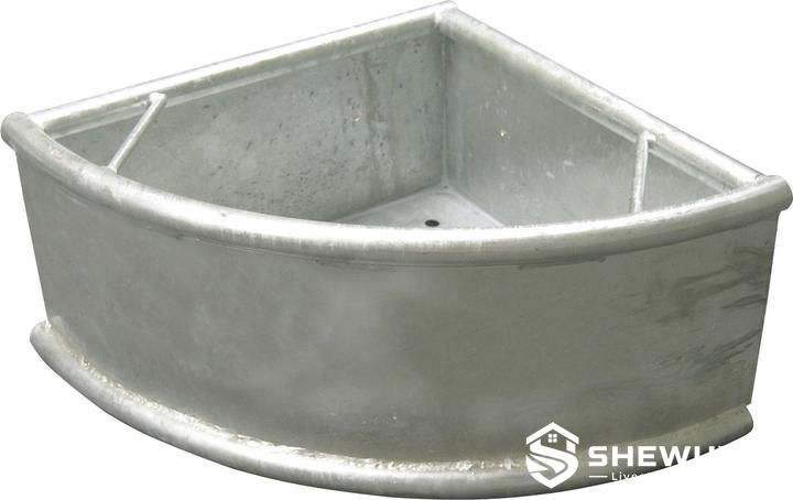 corner-mounted galvanized cattle feed trough