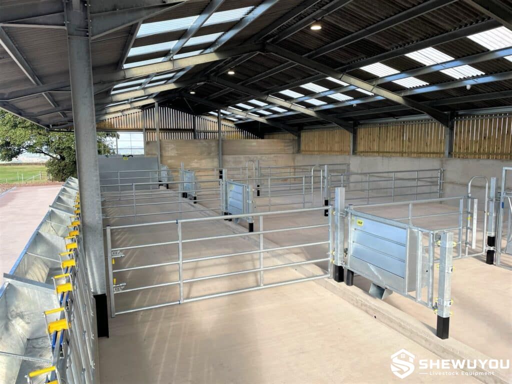 adjustable cattle pen gate installed in livestock housing