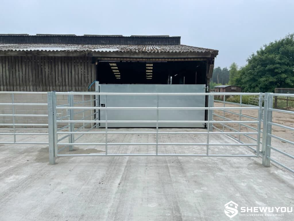 heavy-duty cattle pen gate installation