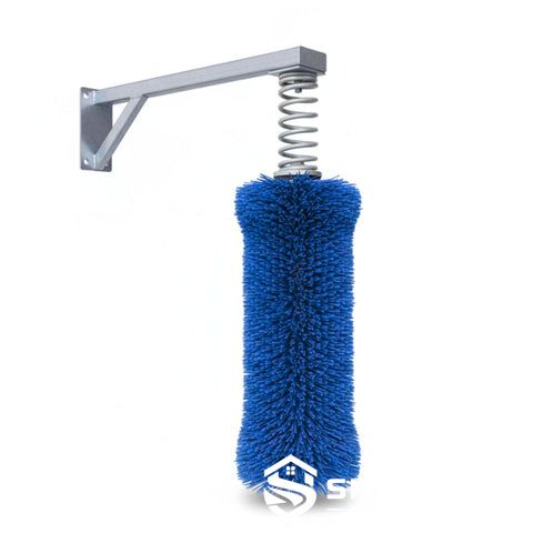 Spring mounted cow brush for dairy cattle