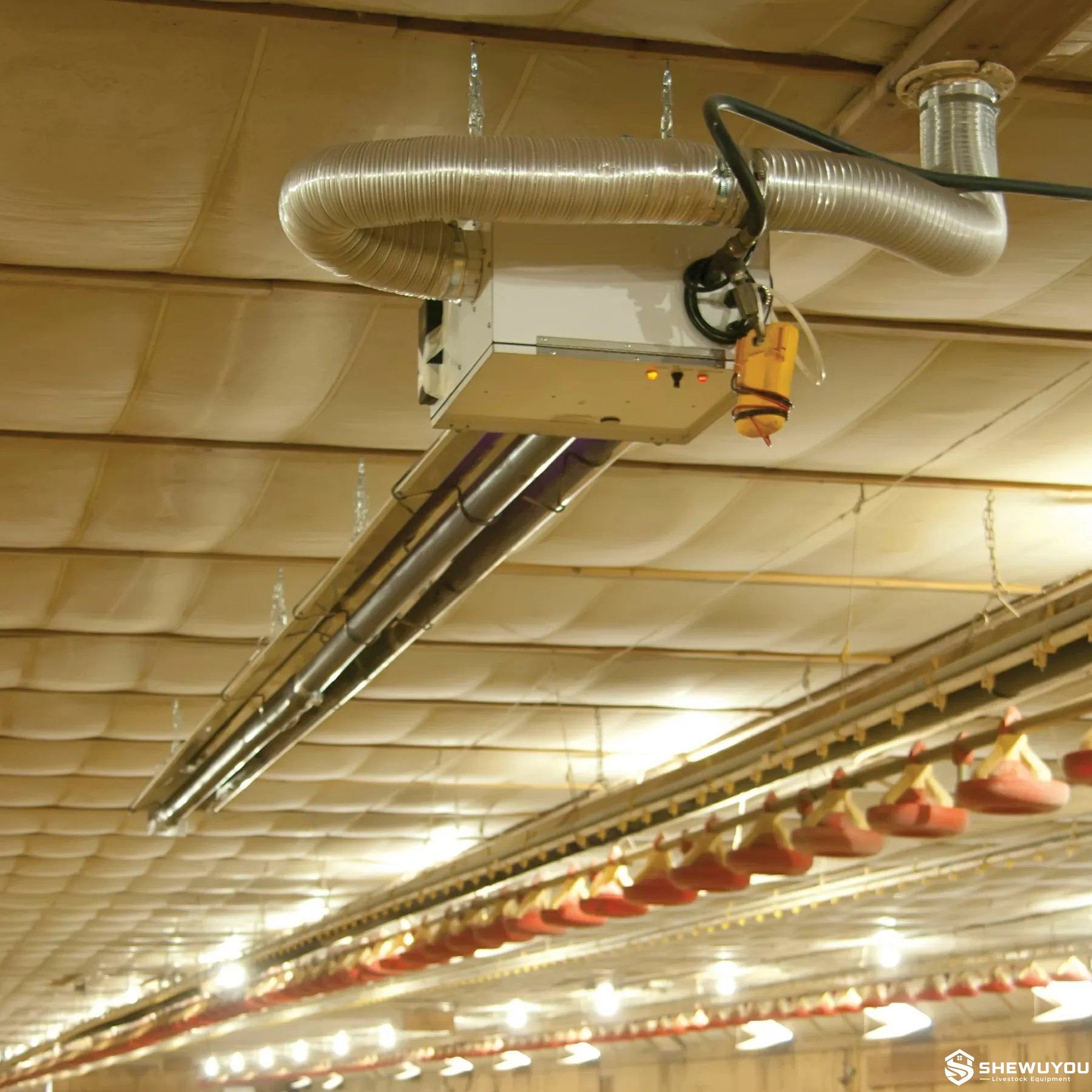 radiant tube heater installed in commercial poultry house