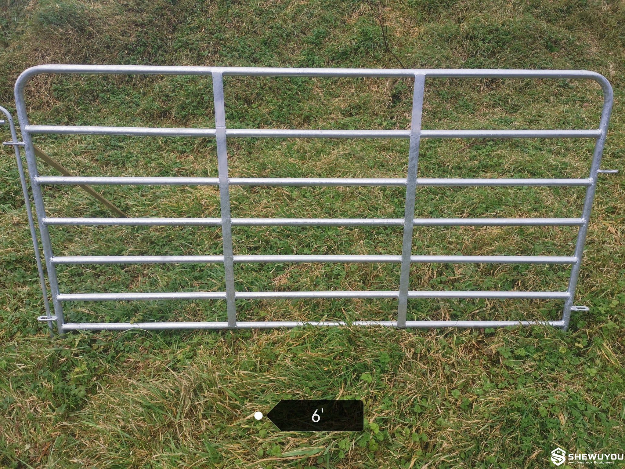 galvanized sheep hurdle installed in livestock pen