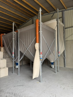 Multiple Indoor Fabric Feed Silos with Conveyor Equipment